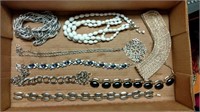 Flat of costume jewelry necklaces