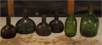 SELECTION OF ASSORTED COLORED GLASS BOTTLES