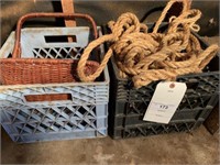 2 MILK CRATES (1 HAS ROPES, OTHER HAS BASKETS