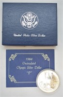 OLYMPIC SILVER DOLLAR W BOX PAPERS