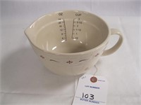 CREAM AND RED MEASURING CUP