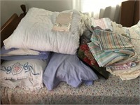 Assorted. Bedding on Bed