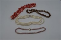 A quantity of pearl and faux pearl necklaces