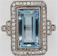 3.79ct aquamarine, diamond halo and gold ring