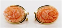 Coral and gold earrings.