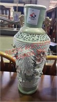 Large vase with ceramic flowers tiny bit of