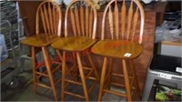 3 wood swivel stools