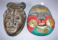 Two various Oriental carved wood masks