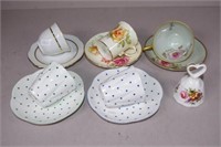 Five assorted coffee cups and saucers