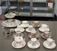 Eleven cup and saucer sets