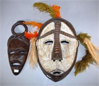 Two various carved wood ceremonial masks