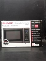 New sharp microwave oven with a black stainless