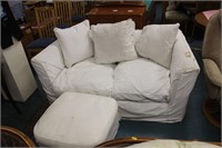 Two seater feather filled sofa with pouffe