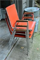 Stacking orange office chairs (3)