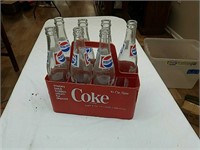 Coke carrier plastic, glass Pepsi bottles