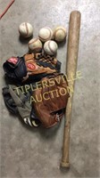 Wooden baseball bat, gloves and baseballs