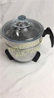 Vintage popcorn popper with fire king lid