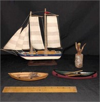 WOODEN SAILBOAT, 2 WOODEN CANOO FIGURINES, AND