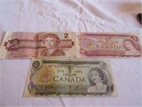 2 Canadian $2 bills and One Canadian $1 bill