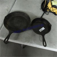 2 cast iron pans- no name