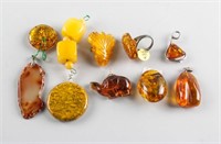 10 Assorted Chinese Amber Pendants and Ring