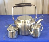 Vintage tea pot with a tea stealer and cream pot