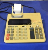 Electric calculator with print out tape