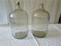 Two 5 gallon glass jugs