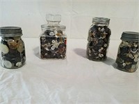 Four jars of buttons