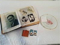 Scrapbook, cigarette papers, and decorative plate