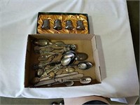 Two boxes of souvenir spoons and salt and pepper