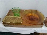 Green and Amber depression glass bowl has a chip