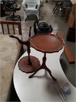 Pair of leather top side tables One has a m