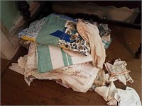 Linens On Floor And Items On Top