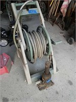 Hose Reel And Bottle Jack As Shown