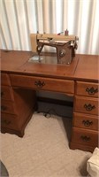 Sewing machine in stand