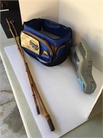 Two fishing poles and one gear bag