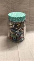 7” glass jar full of misc jewelry
