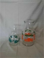 2 glass pitchers 7" and 9"