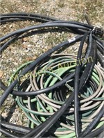 PILE OF WATER HOSES
