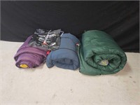 3 sleeping bags and a camp shower