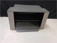 Swiveling TV stand. Measures 21 ins tall X 35 in