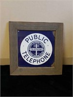 Rustic framed porcelain public telephone sign.