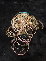 Large collection of metal bangle bracelets