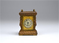 Antique patinated metal miniature mantel clock