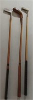 3 wooden golf clubs