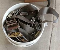 Bucket of ratchet strap parts