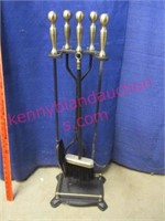 set of fireplace tools on stand