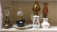 Four  miniature 8 inch oil lamps with glass and