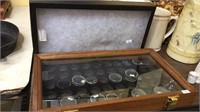 Two glass top display storage cases, one is wood
